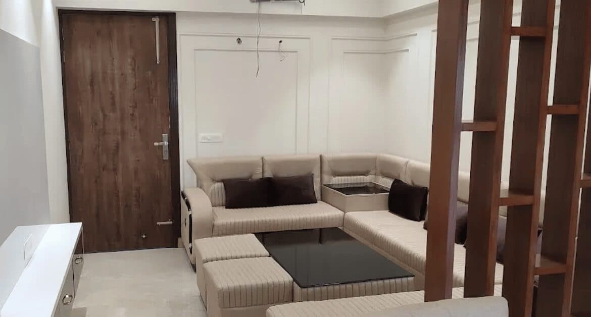 Shri Krishna Residency amenity view, landscaped courtyard between the tower and the boundary wall.