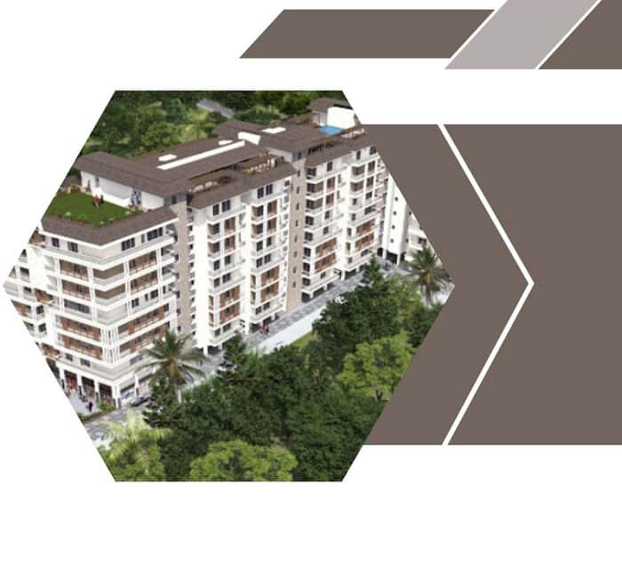 Sikka Kingston Greens tower on Rajpur Road, white facade with rooftop terrace and mature trees framing the base.